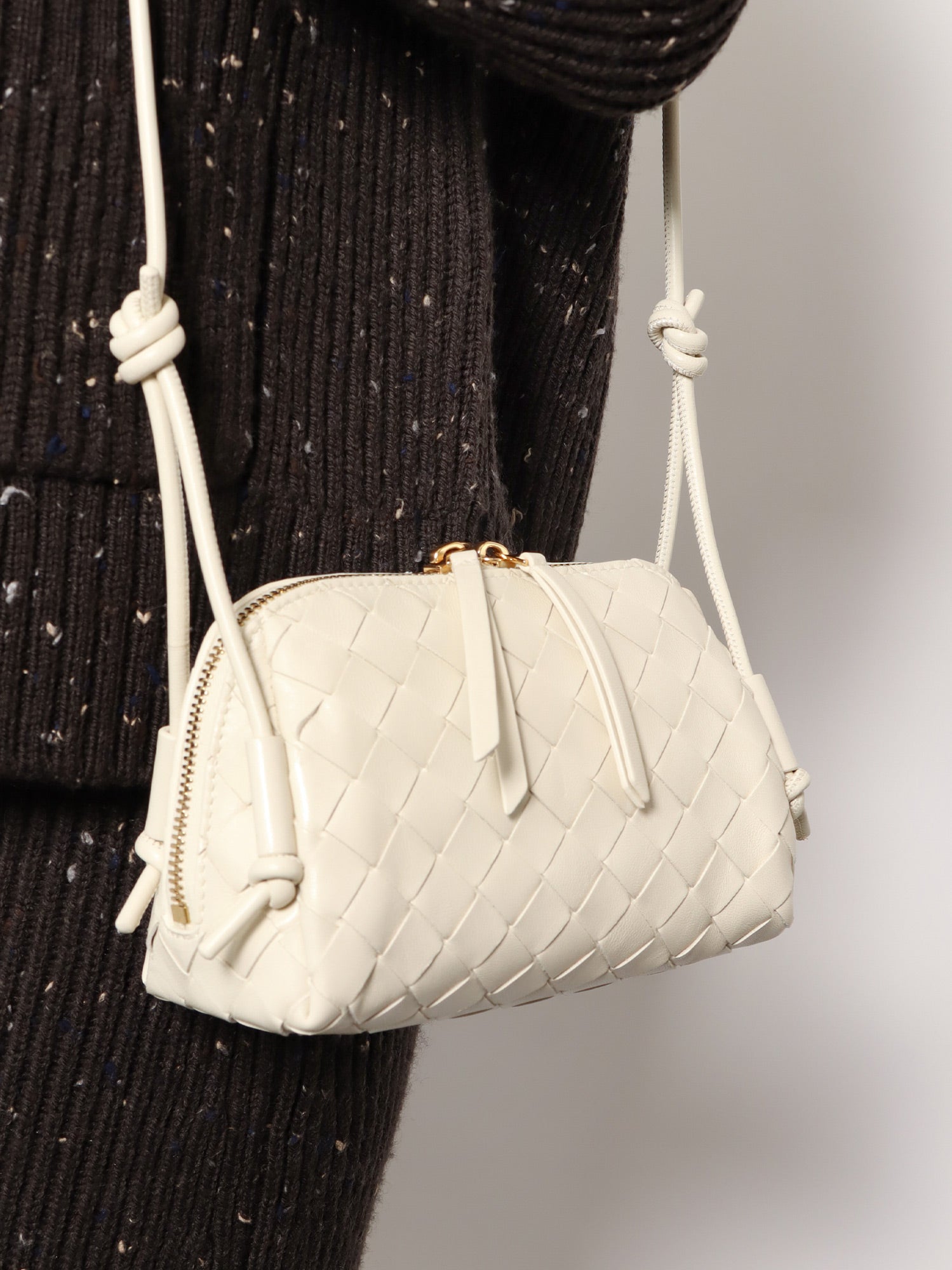 Bottega Veneta Concert Pouch Leather Crossbody Bag With Intrecciato Motif