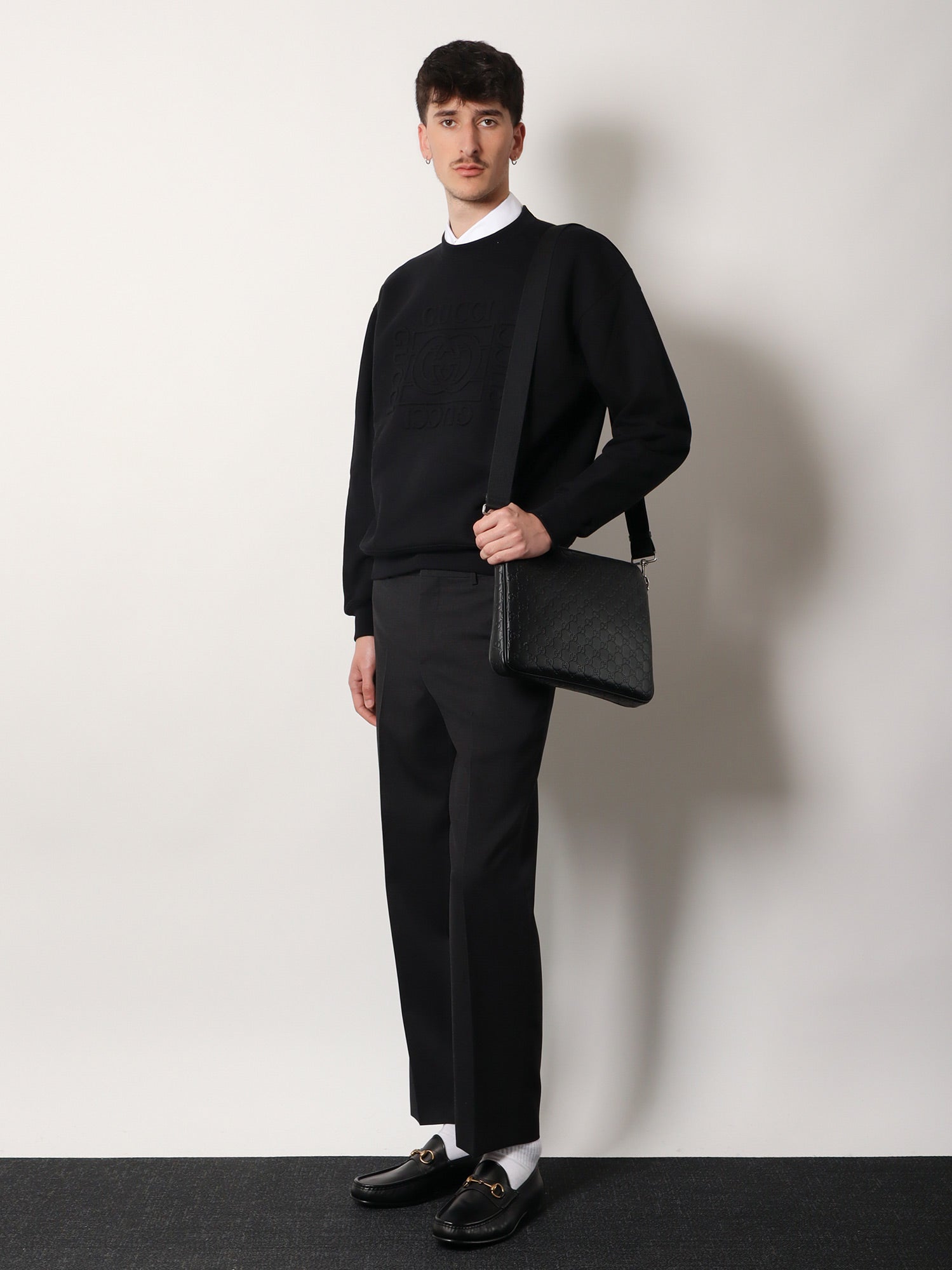 Gucci Leather Gg Emblem Crossbody Bag With Embossed Gg Motif