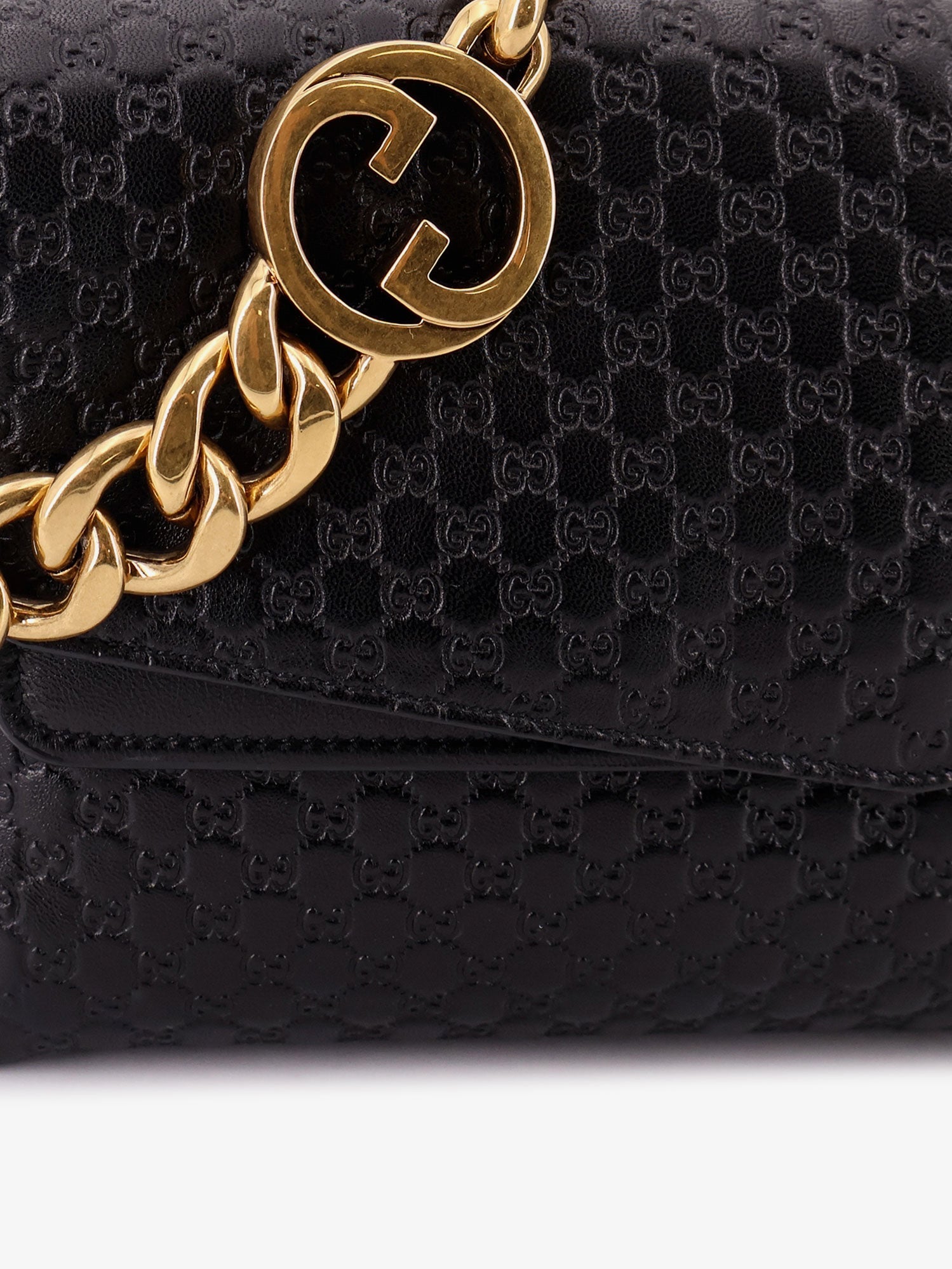 Gucci Leather Crossbody Bag With Embossed Gg Motif