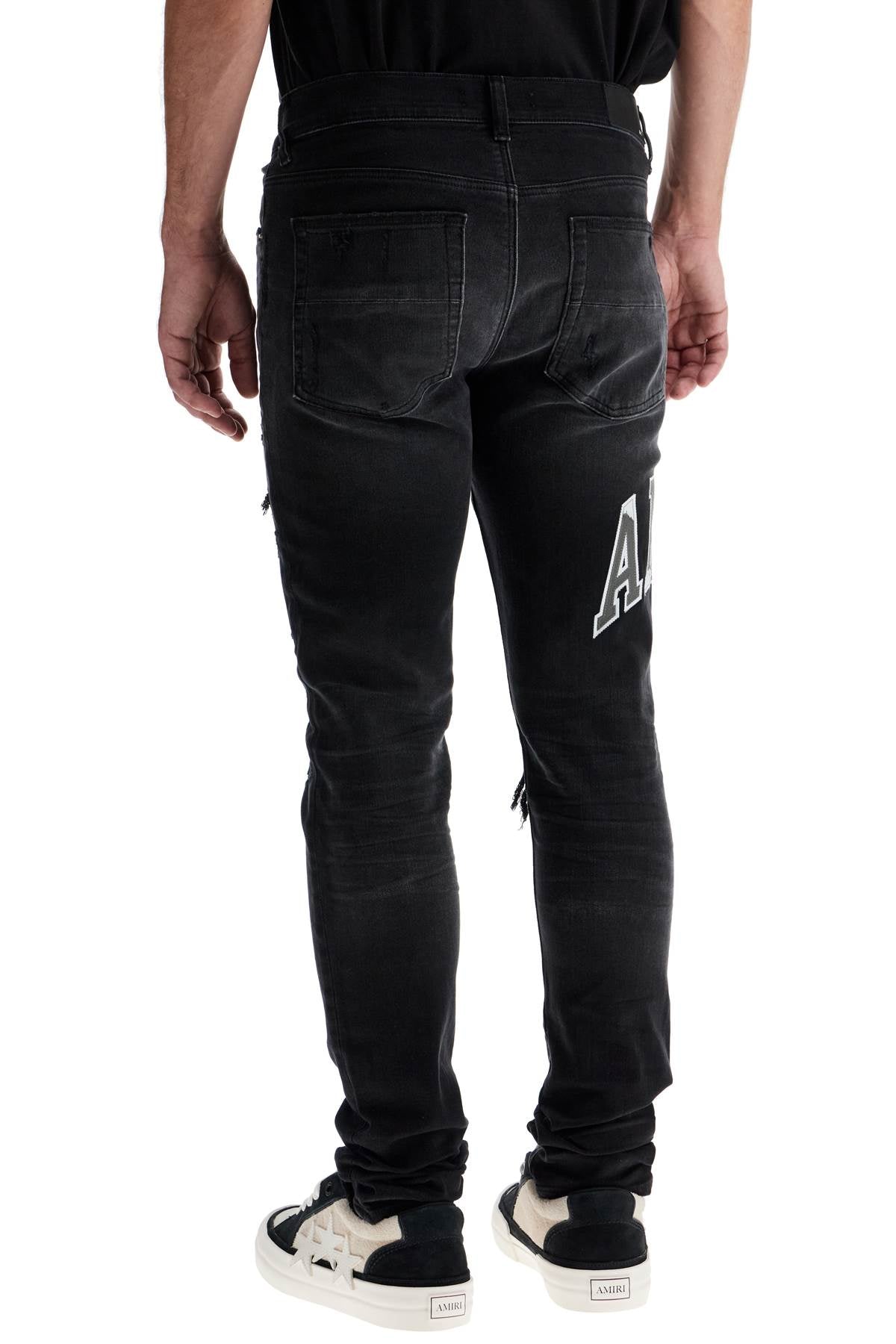 Amiri Skinny Jeans With Varsity Logo Black